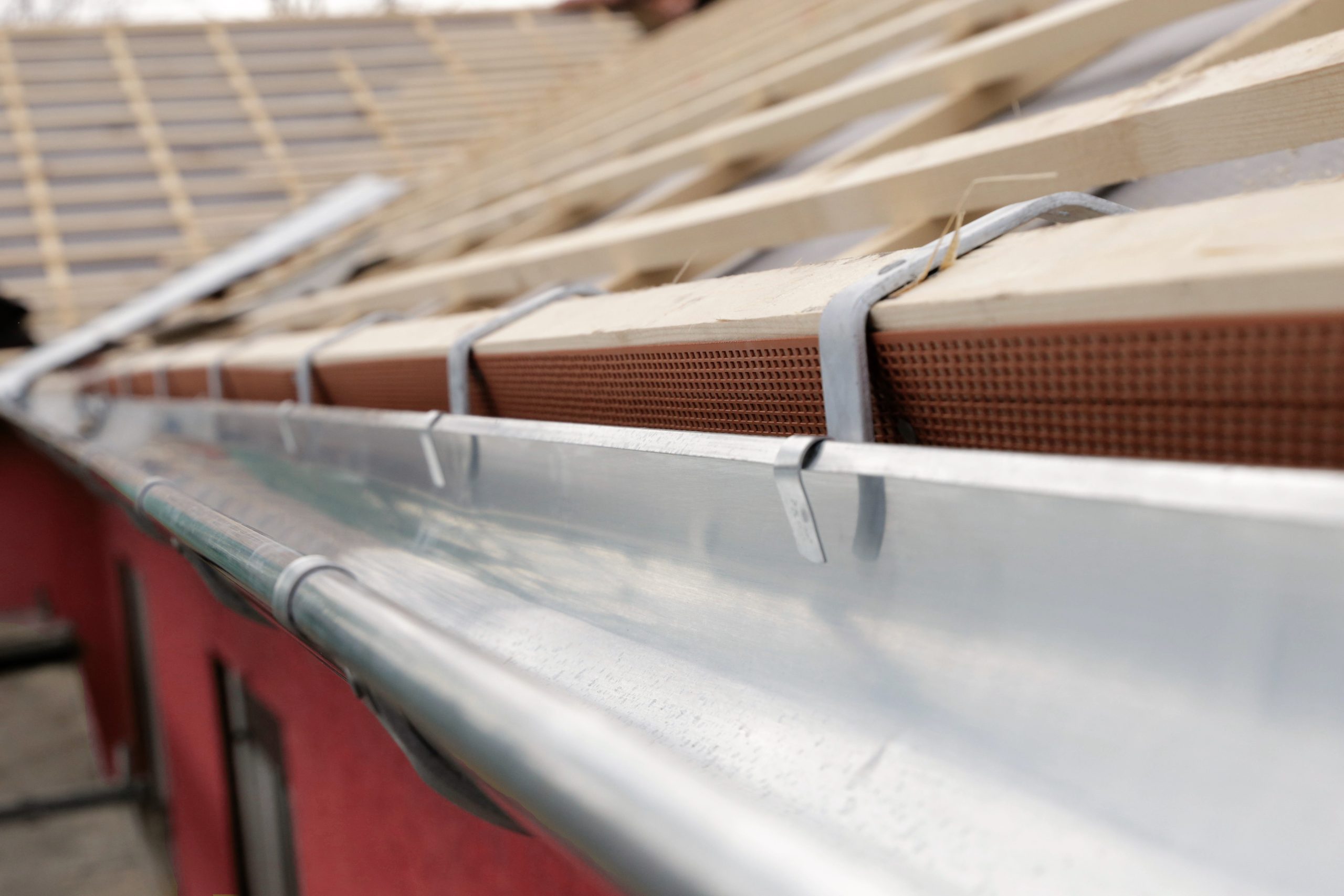 Connector plastic drip gutters on the roof, close up